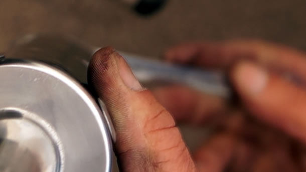 Photo of hands forming an exhaust compression chamber